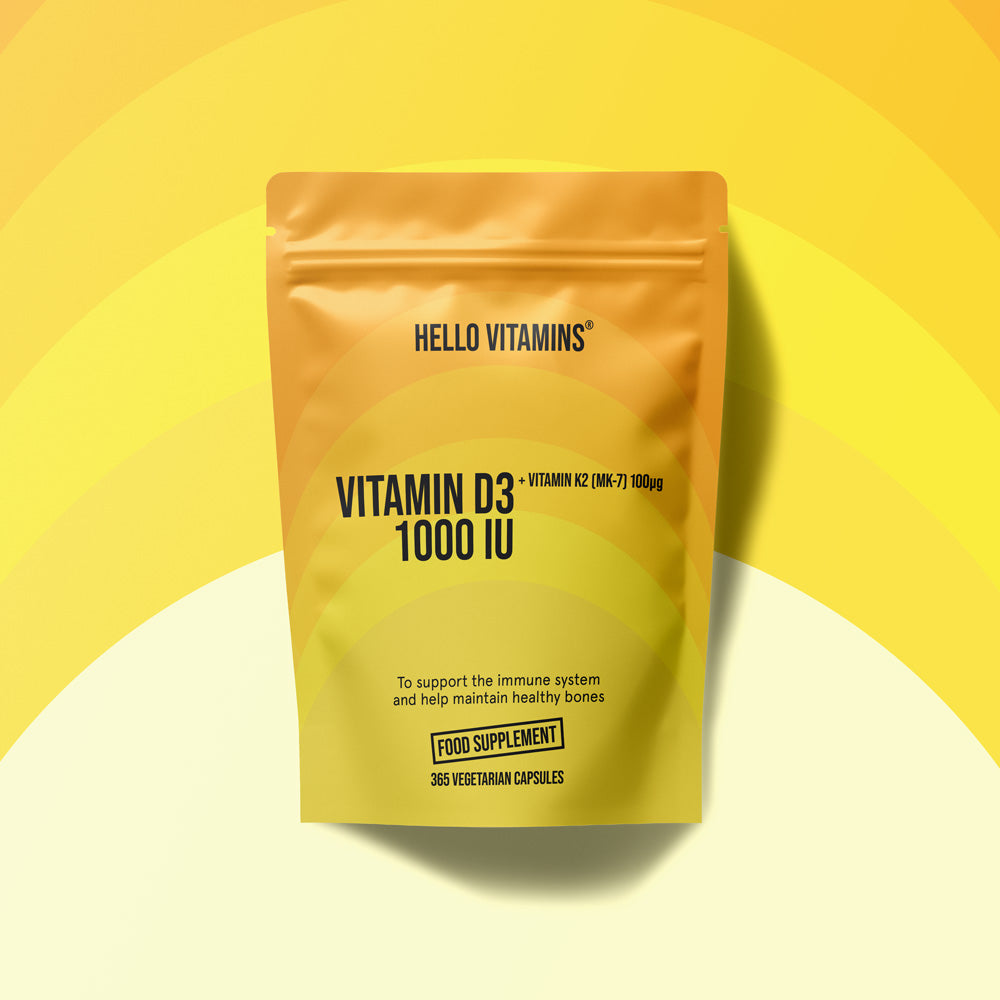 Yellow supplement package labeled 'HELLO VITAMINS' on a yellow background
